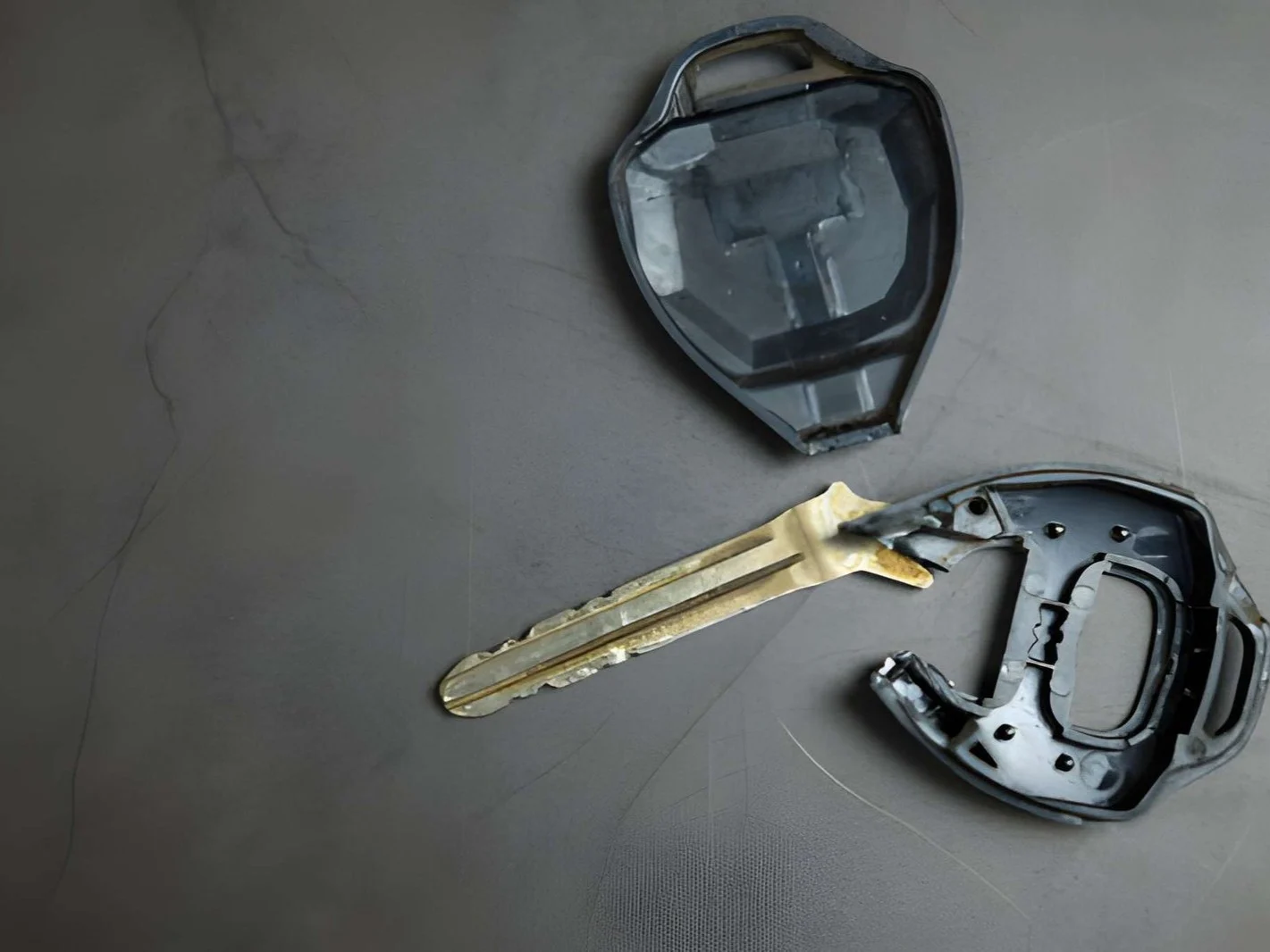 Close up dirty broken or damaged car remote