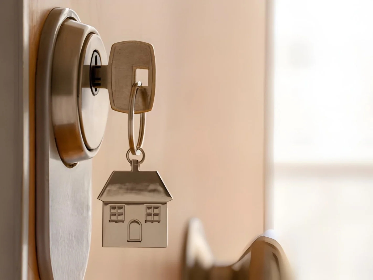Close up of key and house keychain
