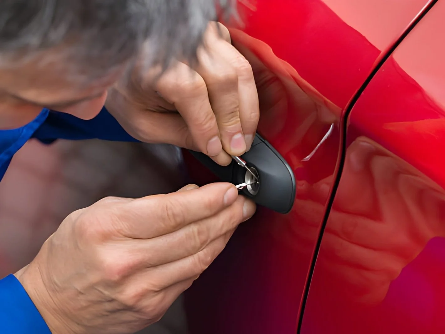 Hand holding lockpicker to open car door 8